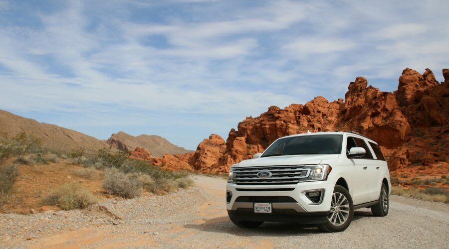 parked white Ford Explorer SUV