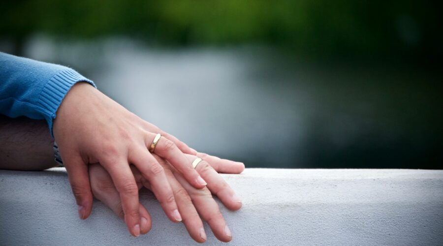 two hands on gray surface