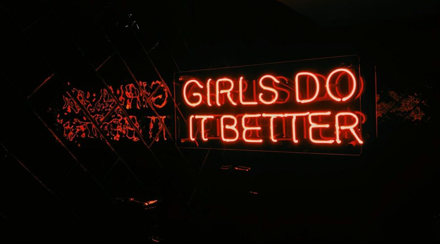 a neon sign that says girls do it better