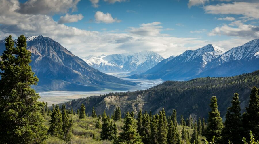 green mountain across body of water