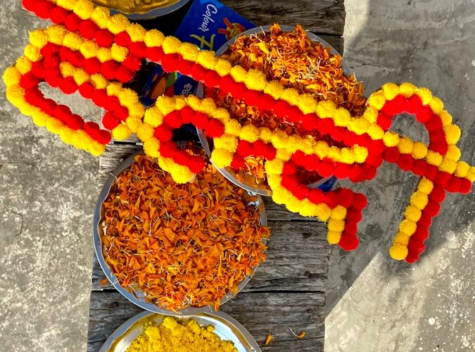 a wooden table topped with bowls of food